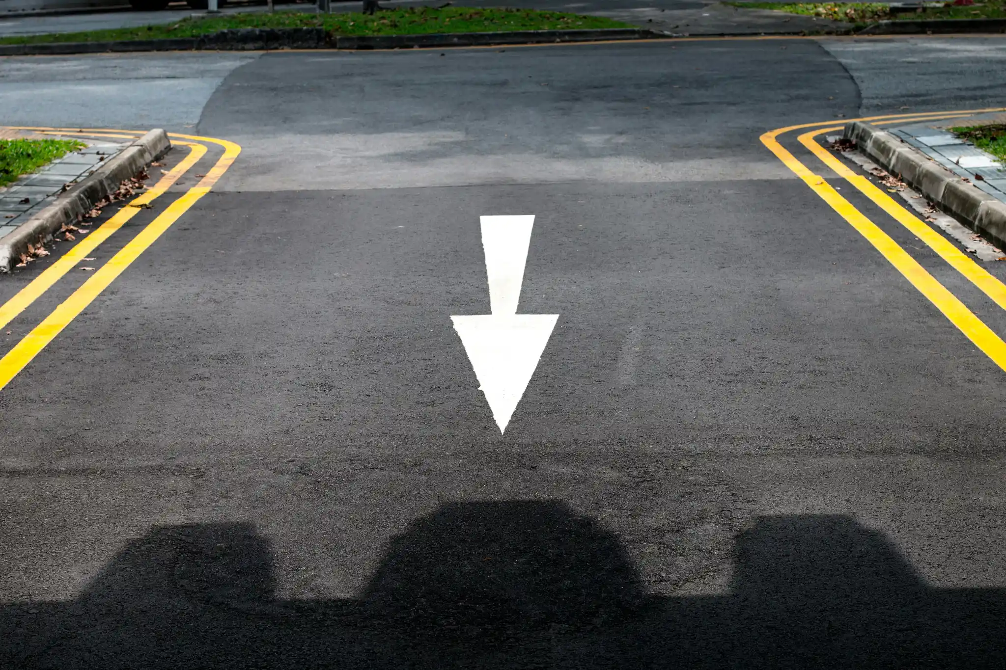 Painted curb lines on an Ontario roadway for improved traffic visibility.