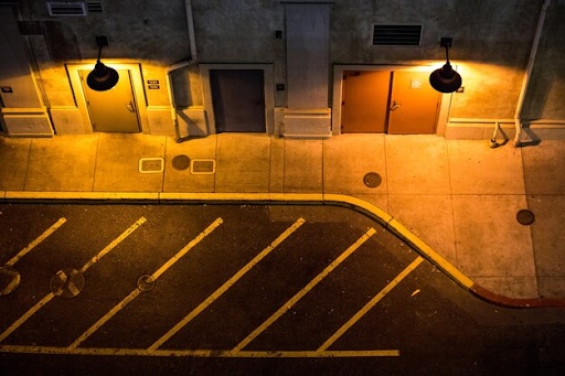 Road line painting improving parking organization, visibility, and safety.
