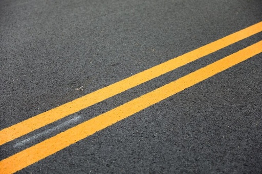 Two yellow straight road lines
