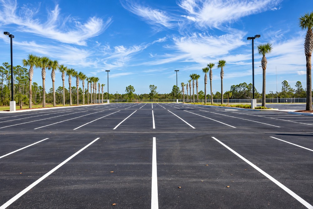 Parking lot with fresh white line markings.