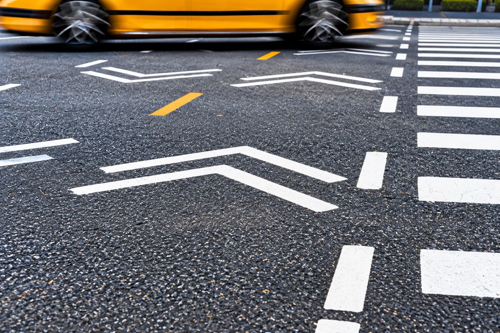 Road arrows and crossing lines.