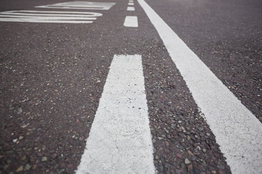 White road lines on asphalt.